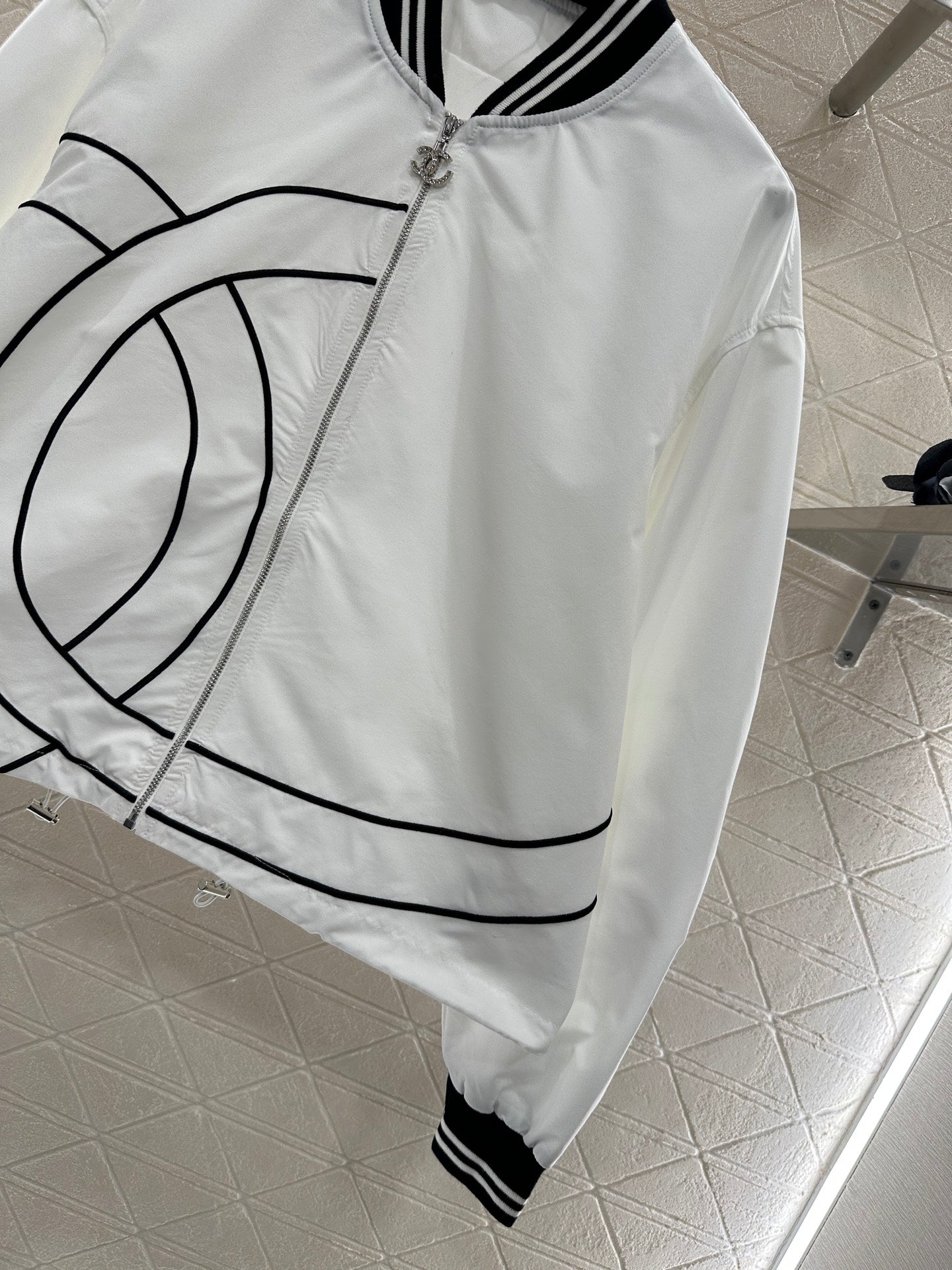 Casual baseball jacket and trousers set.