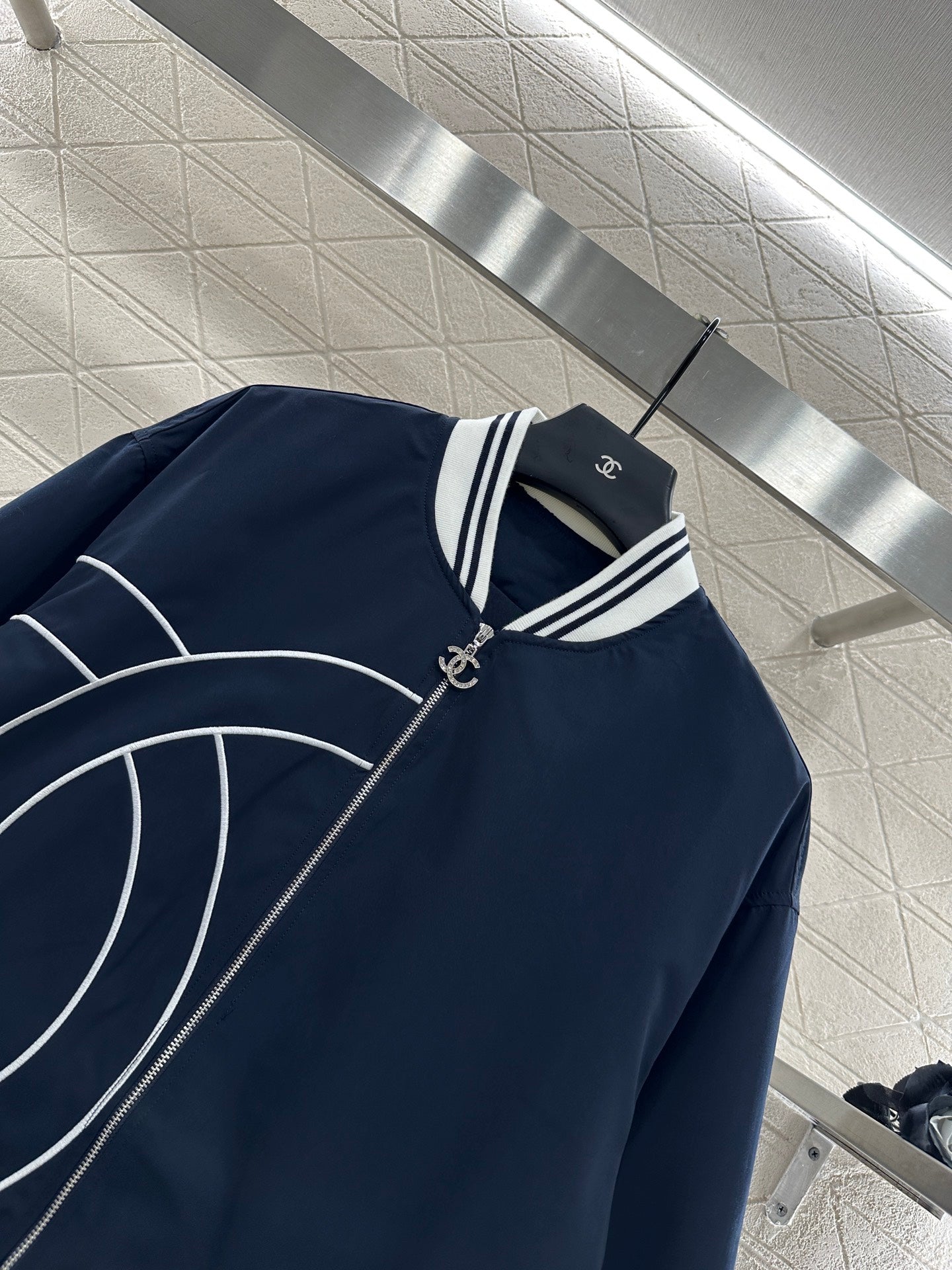 Casual baseball jacket and trousers set.