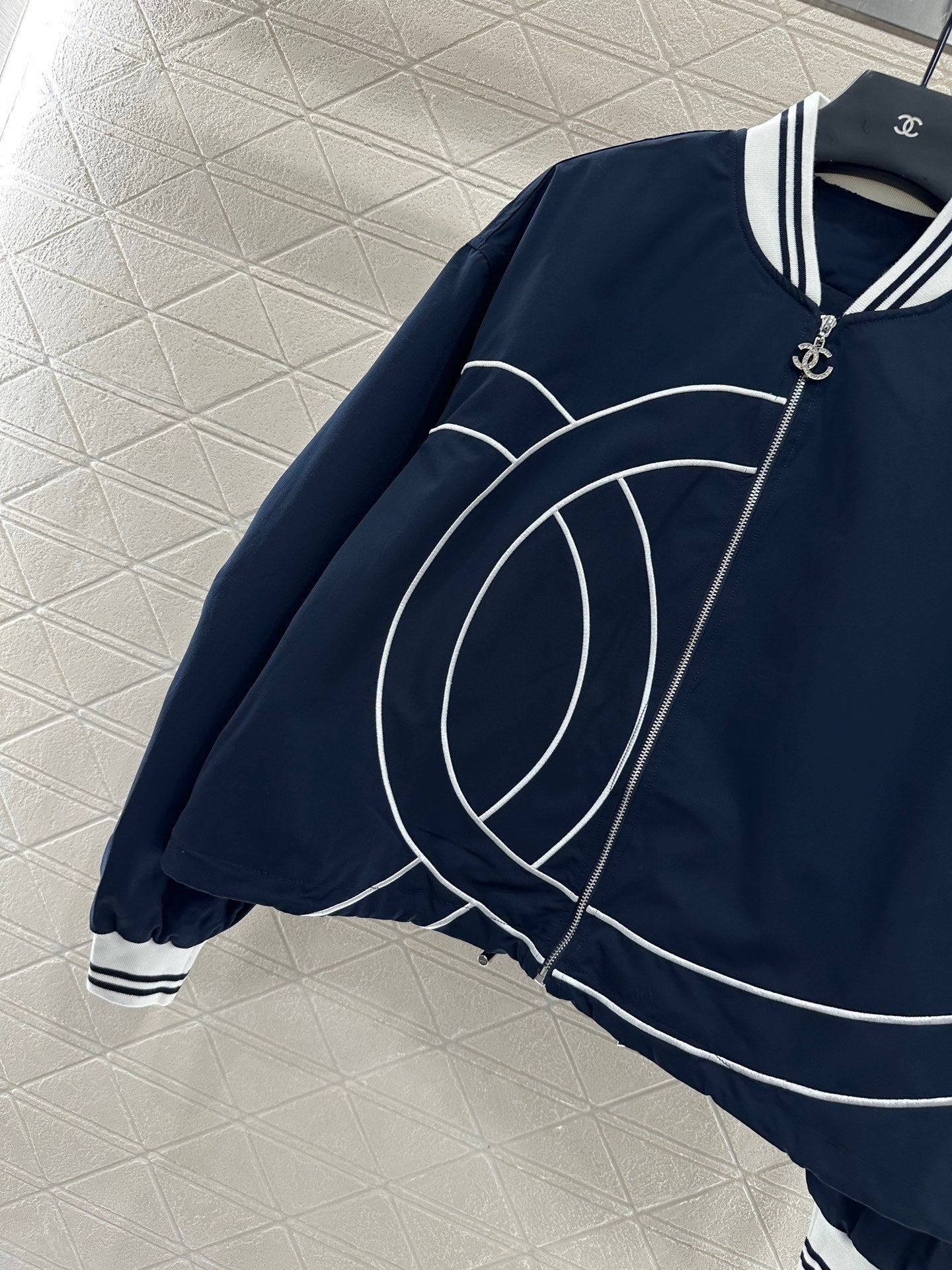 Casual baseball jacket and trousers set.