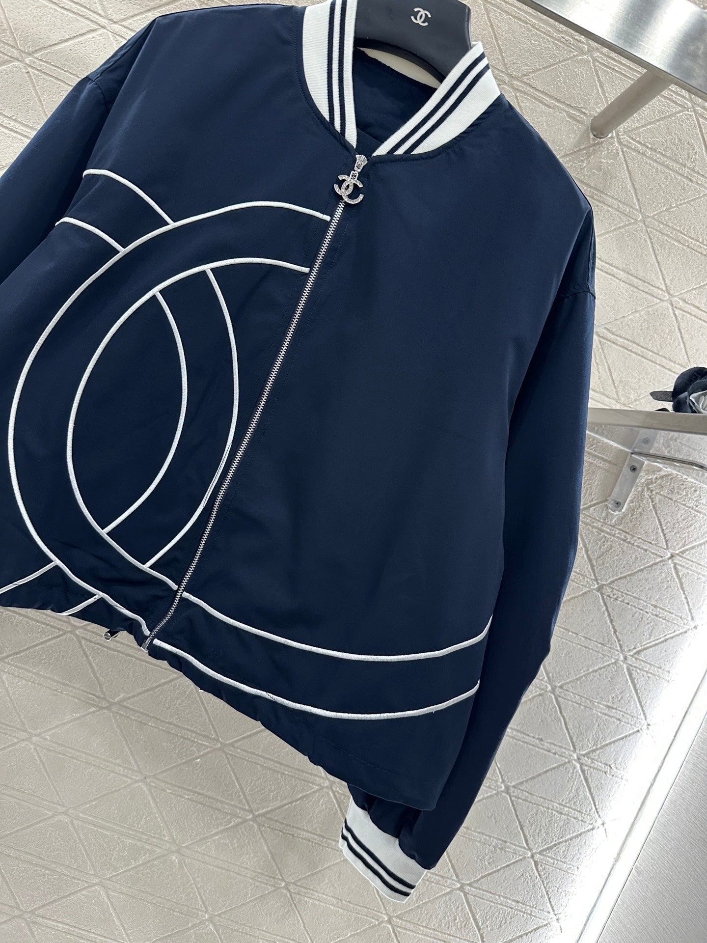 Casual baseball jacket and trousers set.