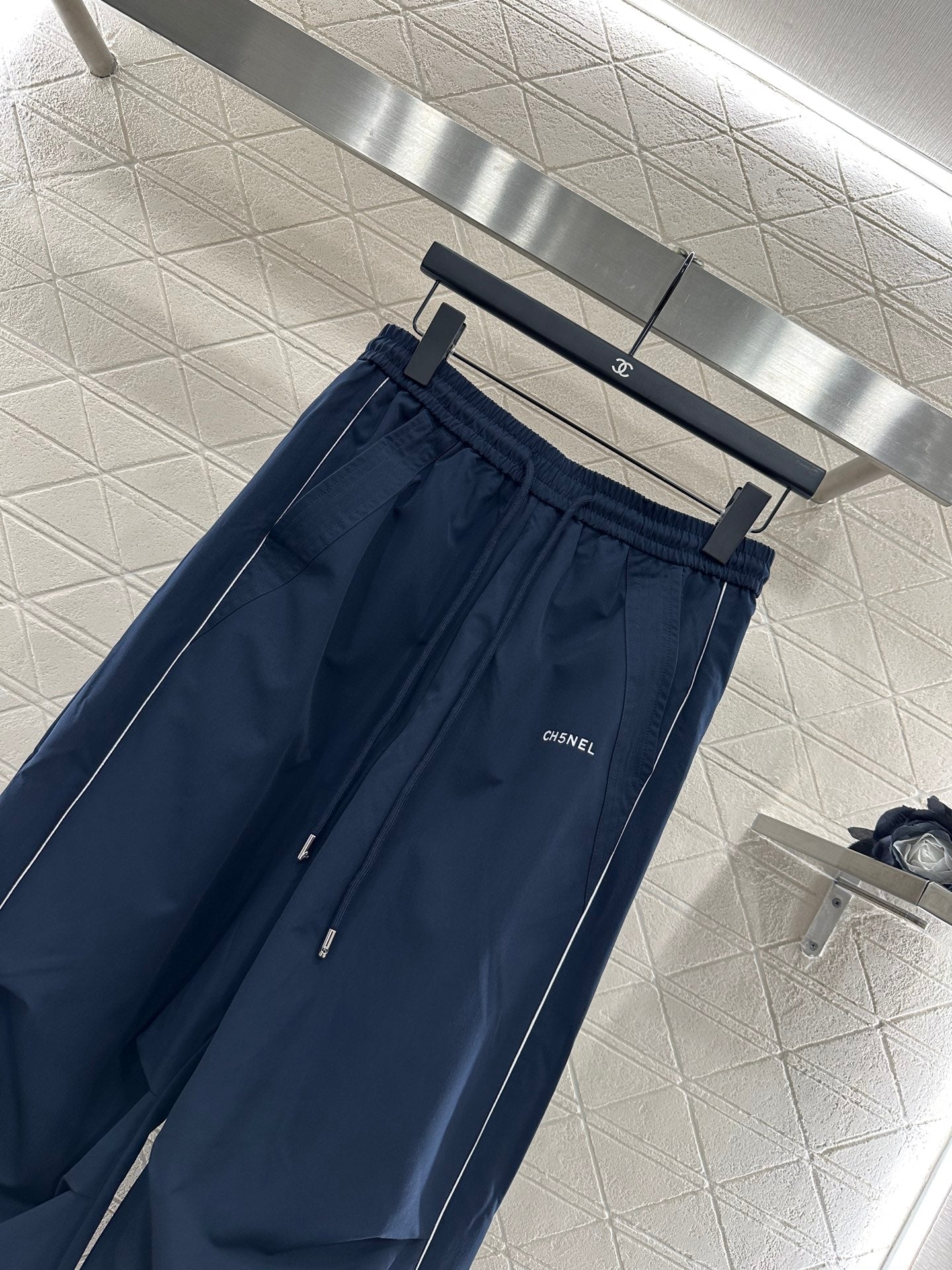 Casual baseball jacket and trousers set.