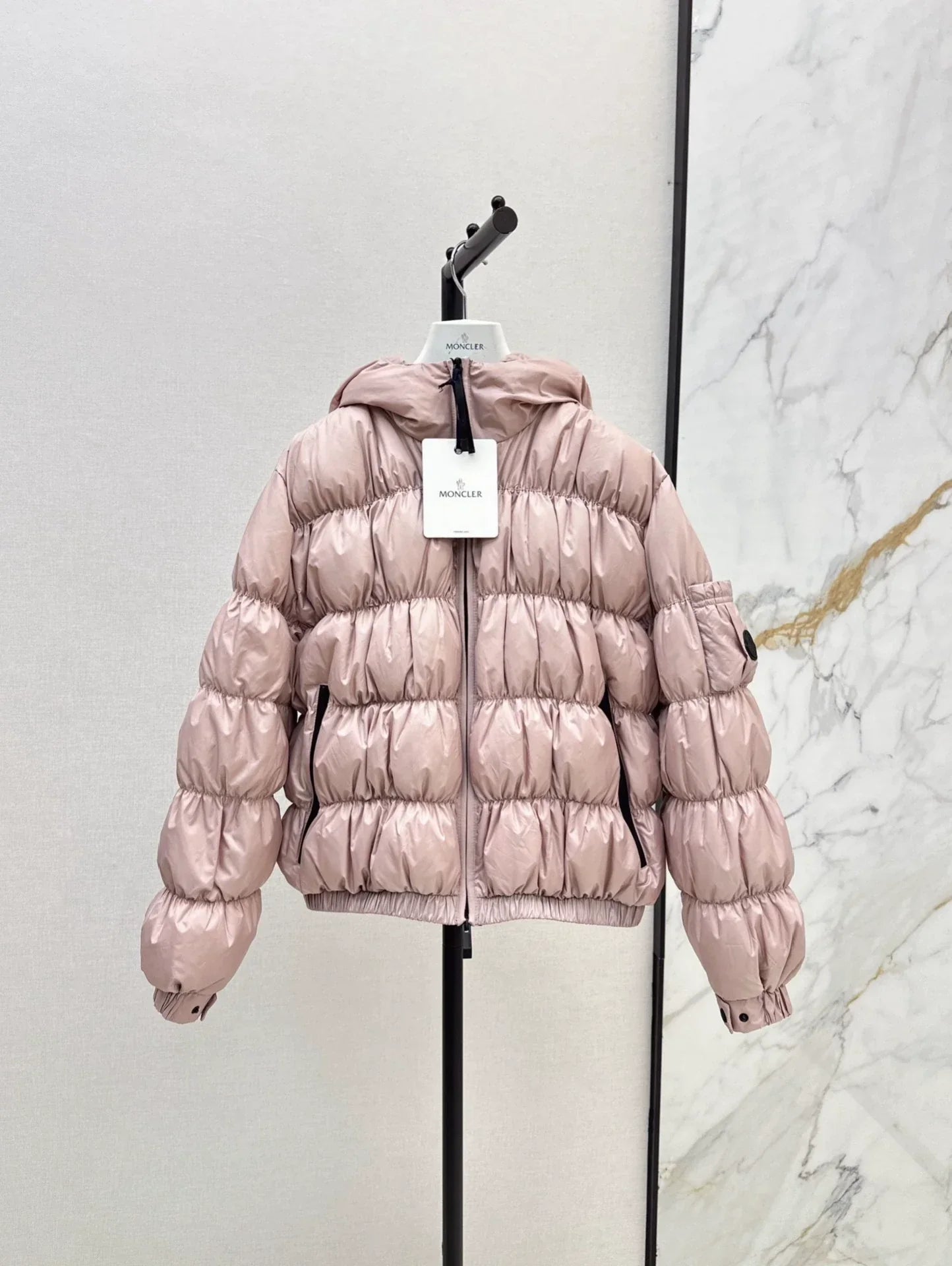 25 Pleated decorative hooded down jacket