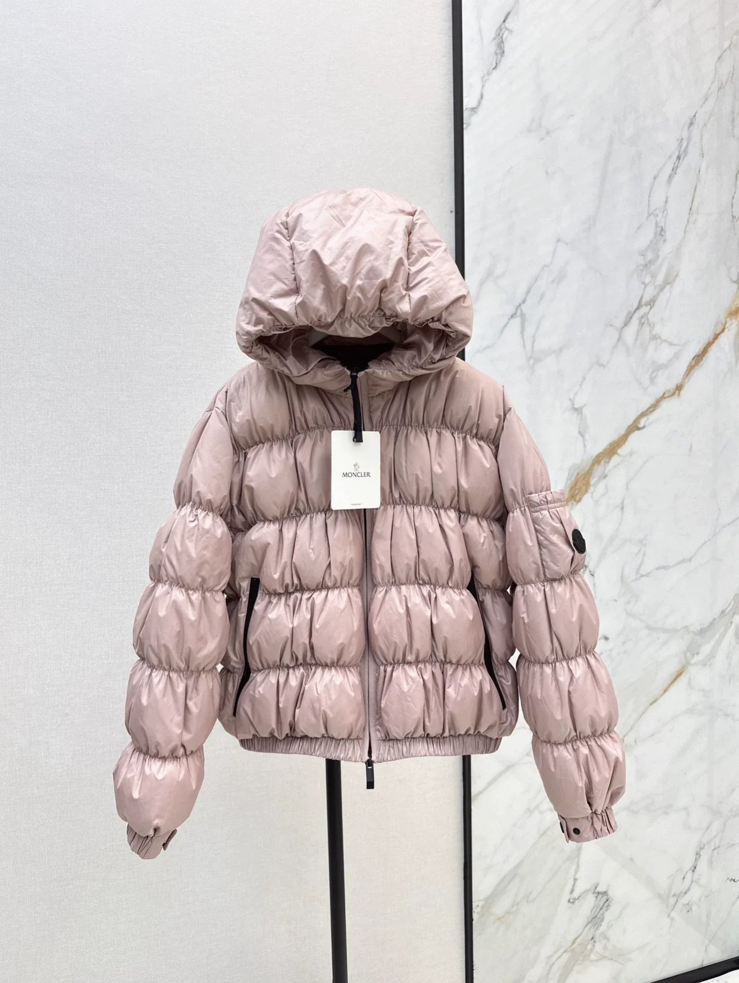 25 Pleated decorative hooded down jacket