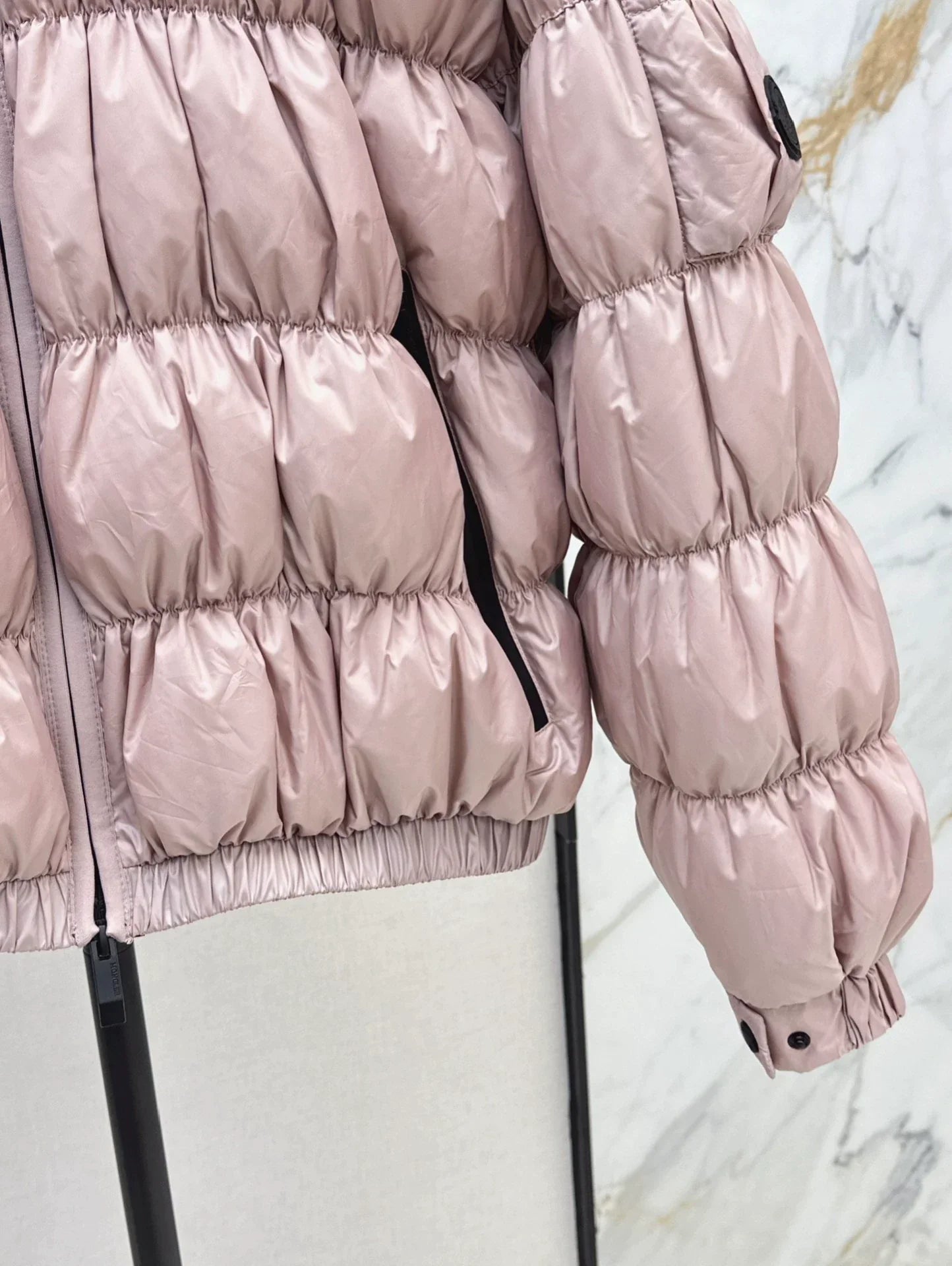 25 Pleated decorative hooded down jacket