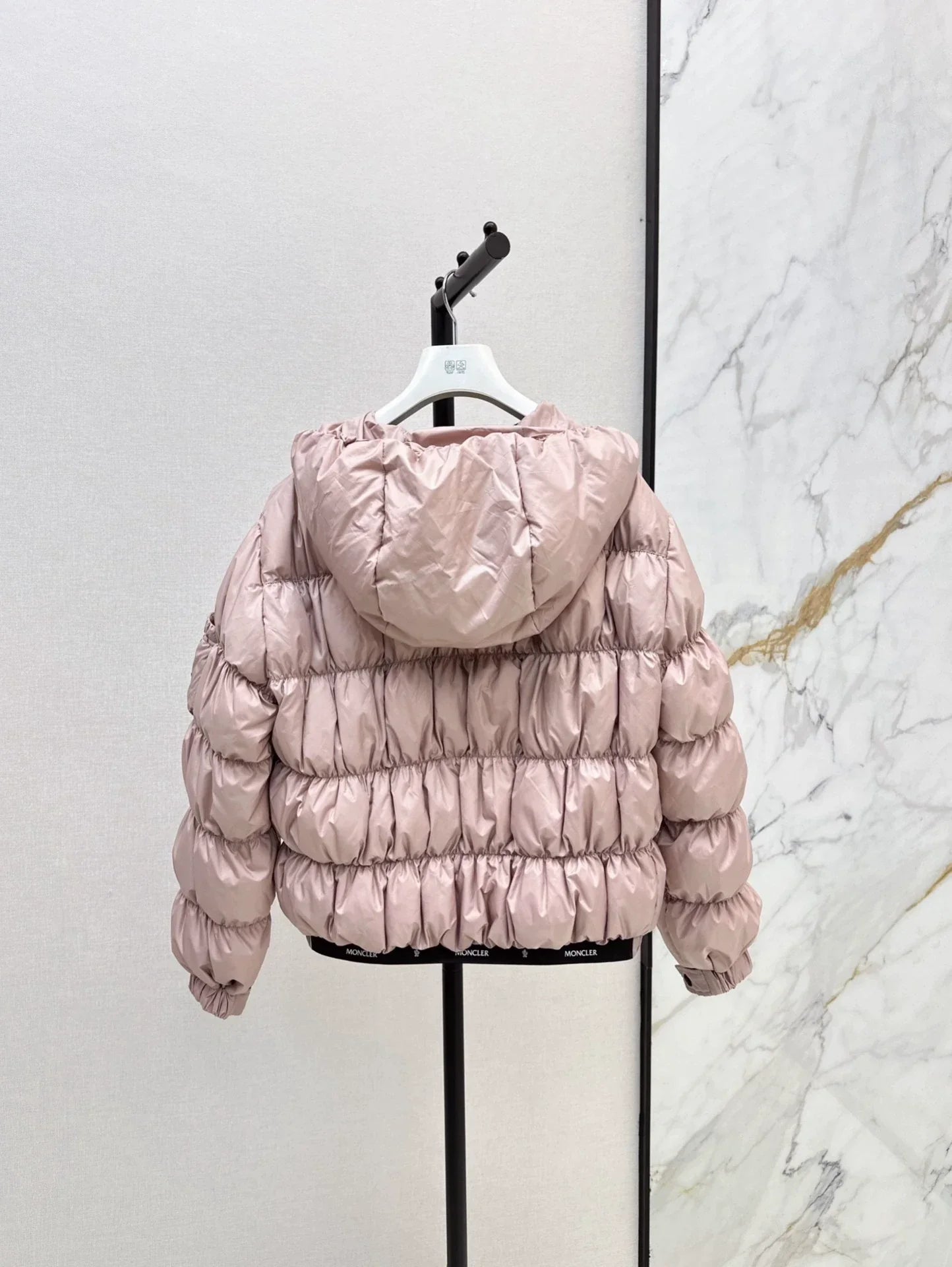 25 Pleated decorative hooded down jacket