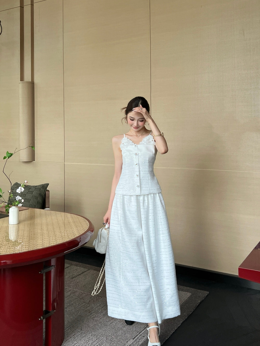 C 25 High-waisted pleated skirt with waist chain