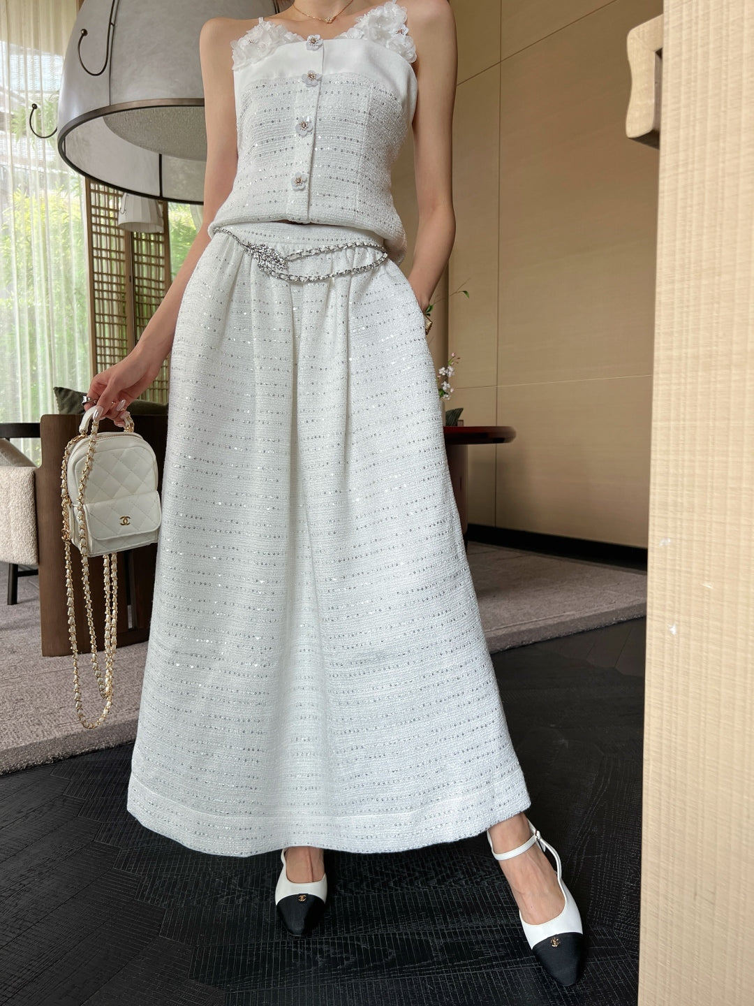 C 25 High-waisted pleated skirt with waist chain