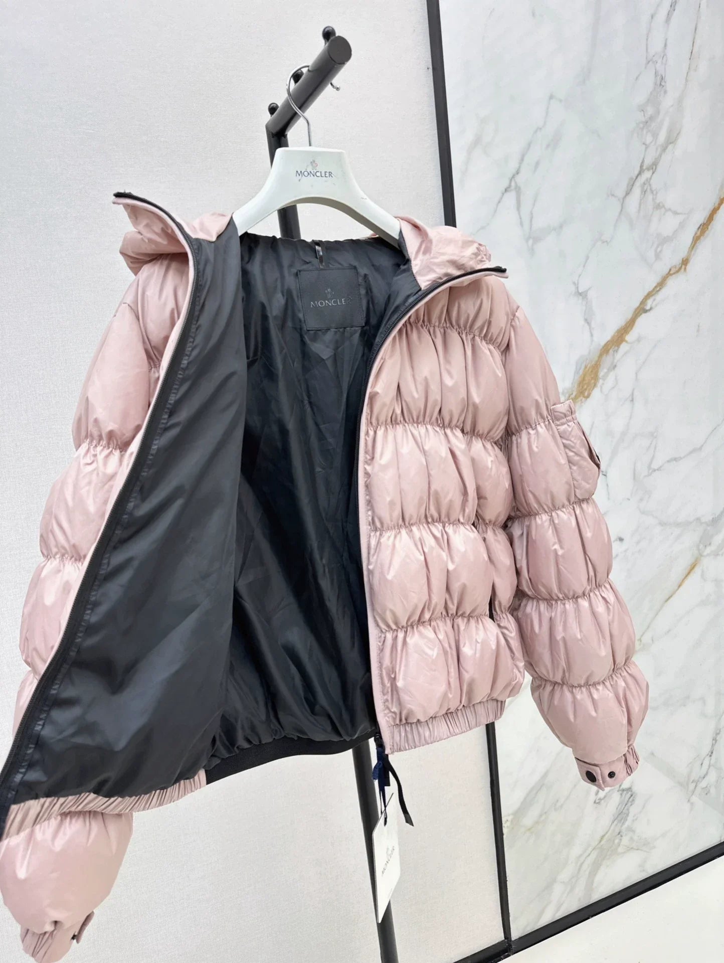 25 Pleated decorative hooded down jacket