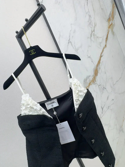 White floral top with black suspenders Vest
